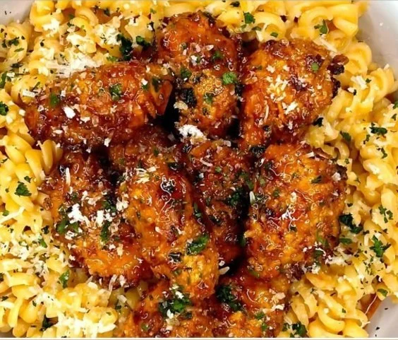 Delicious Hot Honey Chicken Pasta dish garnished with herbs
