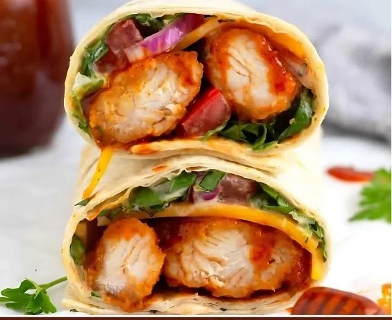Delicious hot honey chicken wraps with fresh ingredients ready to eat